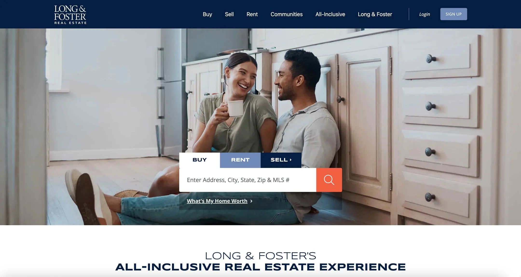 Long & Foster home page with a couple in a kitchen and a home search box